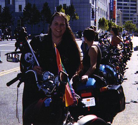 [LA putting flags on her bike
before the parade]